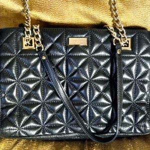 Kate Spade of New York.  Quilted cow leather in black shoulder bag.
